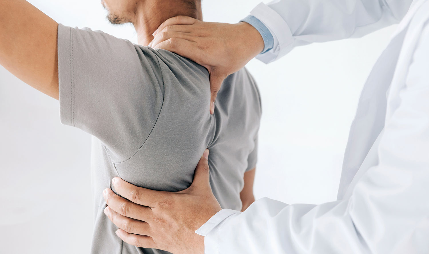 man before seeing spine surgeon in Long Island